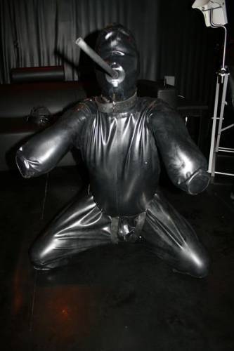 strappedown:  Unfortunately for Zach, the rigid rubber gag in the gimp suit made