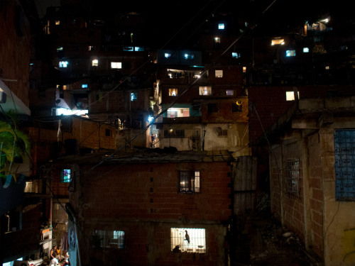 africansouljah:Jerome SessiniVENEZUELA. Caracas. March 15, 2013.Police patrol in Petare, one of the 