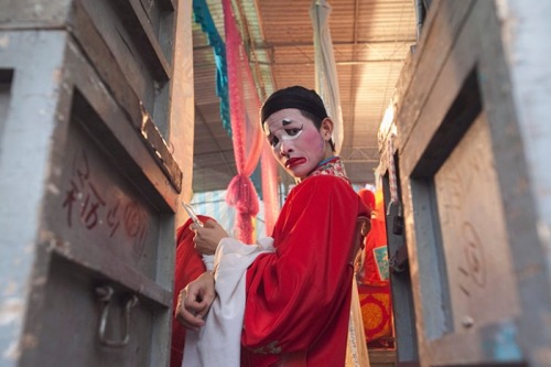 unearthedviews: Penang, Malaysia: An opera singer waits to go on stage during a performance in Georg