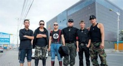 Here  http://shanghaiist.com/2015/04/06/images-emerge-mongolian-neo-nazi-assaulting-chinese-tourists.php