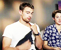 divergents:  Theo James + playing with his shirt 