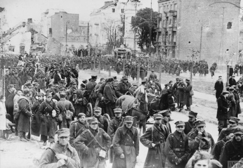 Captured Polish troops march out of Warsaw after the Germans took the city on September 28th, 1939.