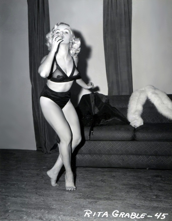    Rita Grable dances around barefoot.. From a 50’s-era photo series shot by Irving