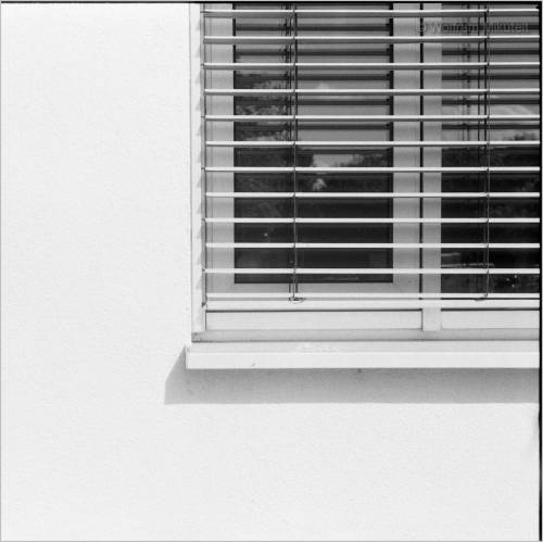   Window on white concrete. 2021.  Photo: © Wolfram Mikuteit  Shot with Contax IIIa (make: 1957), 35