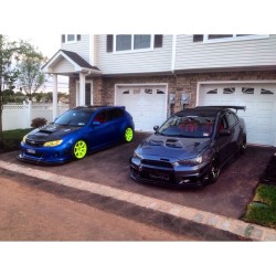 automobilesandfemales:  Me and @1llest_evox with the Mistresses #subaru #wrx #sti #mitsubishi #evo #evox #varis #workwheels #volk #rays #seibon #cosworth #ets #worksbell #apr #racecar #subaru_vs_mitsubishi