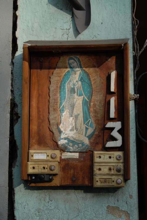 allaboutmary:The Virgen de Guadalupe protects door bells in Mexico City.
