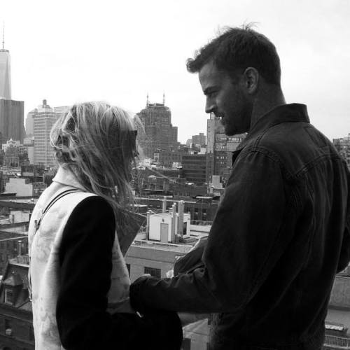 Dakota Fanning and Jamie Strachan having a moment on a NYC rooftop.