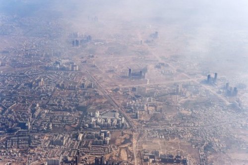 Smog envelops buildings on the outskirts of the Indian capital New Delhi in November, 2014.