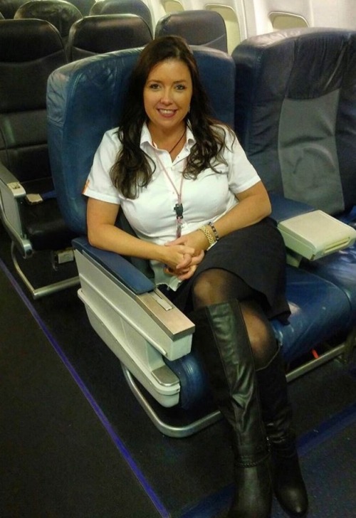 neil2164: A warm welcome form an airline stewardess in black pantyhose and boots.