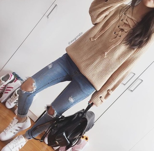 thestylexplorer:  V Neck Eyelet Lace Up Loose Sweater >> Blue Knee Ripped Jeans >> 