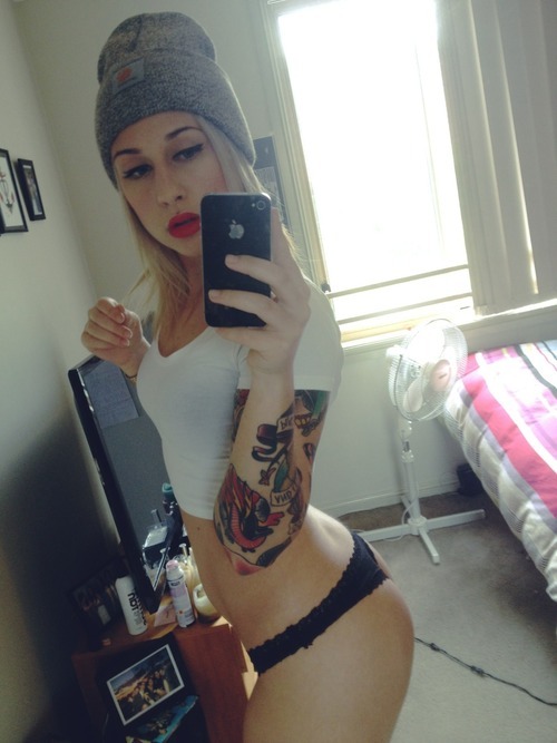 hot tattooed blonde selfshot her great ass and natural boobs in sexy lingerie