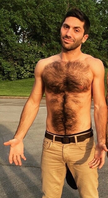 sevenbysixlove:  WOOF!  All that sexy fur really turns me on!   love catching him without a shirt… fucken hot