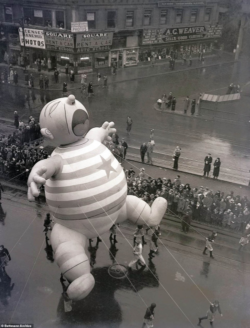 newyorkthegoldenage:  This crybaby balloon was one of the features in a rather rainy Macy’s Thanksgiving Day Parade, 1934. Photo: Bettmann Archive via Daily Mail