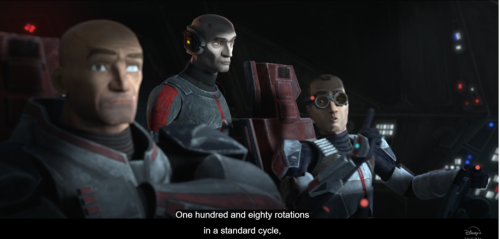Wrecker, Tech and Echo in the cockpit of the Marauder. Tech is speaking with his index lifted in the air. The subtitles read 180 rotations in a standard cycle. Screenshot of The Bad Batch episode one.