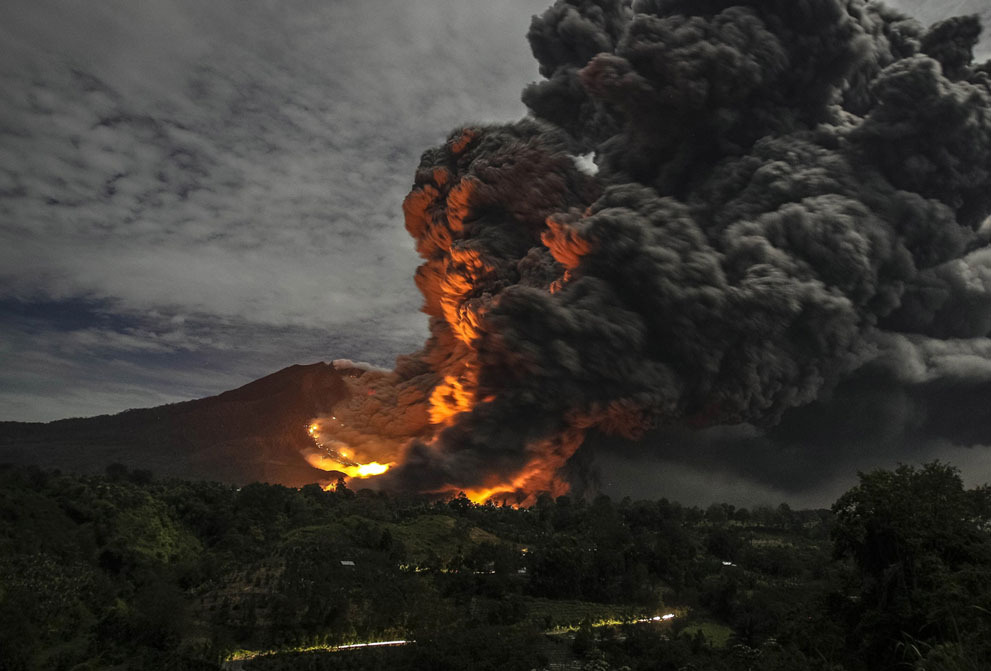 politics-war:  Mount Sinabung volcano erupts, as seen from Tiga Pancur village, Karo