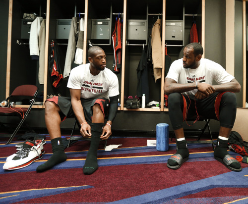 nba:  Dwyane Wade and LeBron James of the Miami Heat in the locker room before the game against the Cleveland Cavaliers at The Quicken Loans Arena on November 27, 2013 in Cleveland, Ohio. (Photo by Gregory Shamus/NBAE via Getty Images) 