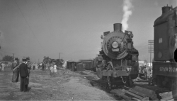 pacificcoastrailroads:  The Derailment of SP MT-4 Class 4355, and P-6 Class 2451 at Glendale in 1935.  The men standing in the last photo, from left to right are: Harry Darms, fireman; Arthur Champlin, engineer; and D.A. Woodruff, fireman. All three men