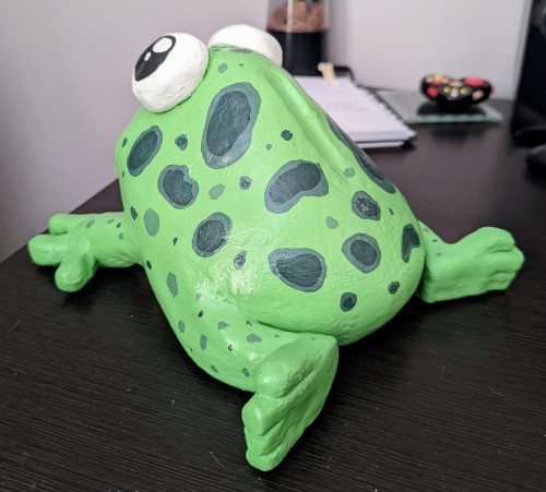 Repainted an old frog sculpture :) It can fit my fist in its mouth easily. Mostly use it to dry pain