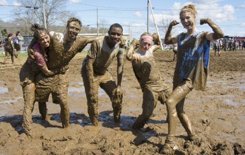 Mud volleyball players