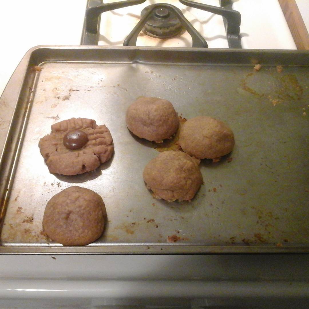 Finished product. 1 egg, 1 cup peanut butter, 1 cup sugar, one Hershey Drop (optional). Mix on high. Roll into ball or mash flat. Stuff Drop inside or lay on top. Bake for 8-10 minutes at 350. #cooking #cookies #authorsofinstagram #snacks #dessert