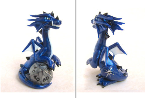 tomarou:  rosesakurax:  thatfilthyanimal:  ensorevolution:  Tiny Dragons That Take Care of Your Gaming Dice http://www.themarysue.com/dice-dragons-becca-golins/#0  [SCREAMS] I WANT THEM  Cuteee  I couldn’t resist reblogging; NO REGRETS 