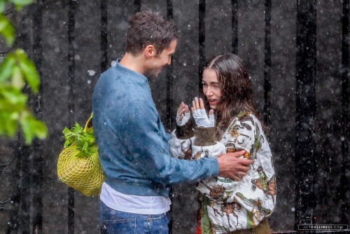 Lily Collins and Lucas Bravo were filming under fake rain Emily In Paris, in Paris today, May 1