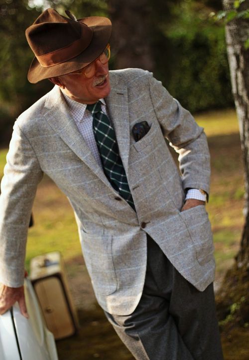 Luciano Barera showing some fine combination skills: light grey windowpane sport coat, dark grey sla