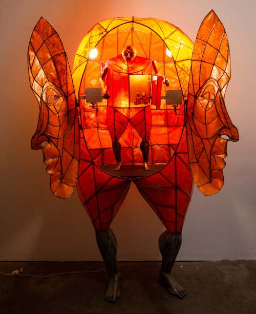blondebrainpower:  “Large Orange Lamp” (2020), steel, paper, glue, red heartwood, gears, electric motors, sprockets, bicycle chain link, 40 × 80 × 40 inchesBy Spenser Little
