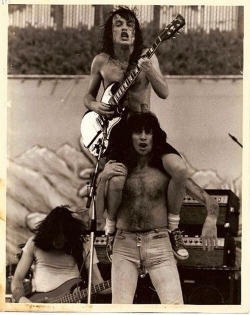 primitiveman-ancientwoman:  Bon Scott and Angus Young