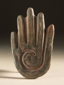 A hand-shaped stamp. Olmec, from Puebla, Mexico. 1000-600 BC.