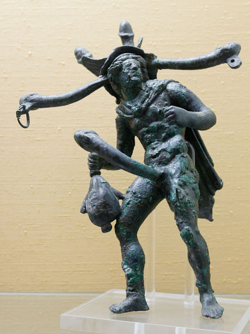 An ancient Roman bronze tintinnabulum (wind chime) depicting the god Tuntus.  Originates f