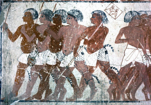 Portrayal of Nubian wrestlersRelief depicting Nubian wrestlers, five men marching together, with the