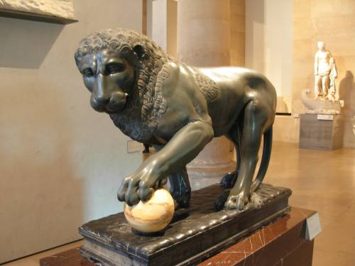 coolartefact:Albani lion - 1st century Roman green basalt lion statue with a yellow marble sphere un