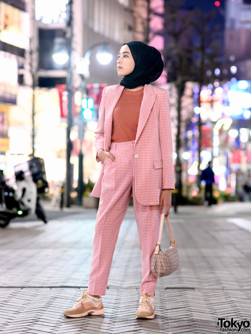 tokyo-fashion:  Amelia Elle, a hijabi fashion blogger from Indonesia, on the street in Shibuya, Tokyo wearing a pink check Zara suit, Fendi logo bag, and pink Chanel sneakers. Full Look