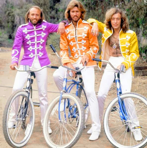 The Bee Gees ride Schwinn bikes to the beach.