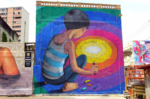 asylum-art:GlobepainterJulien “Seth” Malland aka Seth Globepainter is a Parisian street artist known for his vibrant murals that often depict children gazing into pools full of a rainbow of colors.Seth has been an important a steady contributor in