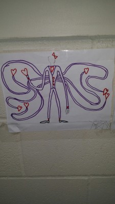 sixpenceee:  ouijahorde:The elementary wing of our school has some… wonderful art, sixpenceee  They’re starting early