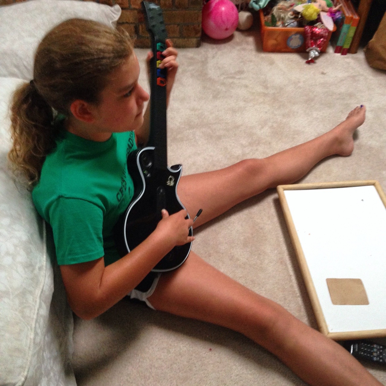 Sarah has discovered Guitar Hero!