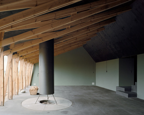 aros:  House with Built-In Window Nook and Interior Fire Pit