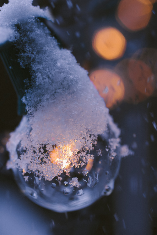 A light-emitting, bulbous object covered in crystalline water ice particulates.