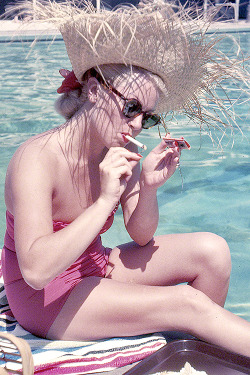 marypickfords:  1951. Santa Barbara, California. Lana Turner lunching by pool at the Coral Casino. 
