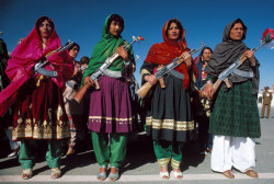 unrar:    Afghanistan, Kabul. May 27, 1986. Armed women in traditional clothes celebrate the anniversary of the Coup d'Etat of 1978,   A. Abbas. 