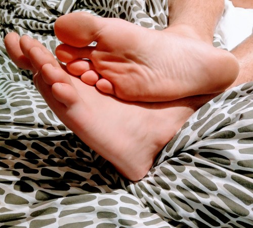 my mates feet chilling on his bed. Look at those soles.