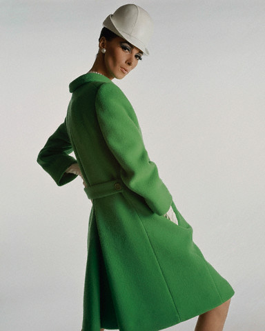 Wilhelmina Cooper wearing coat by Originala, and hat by Lilly Daché in Vogue magazi