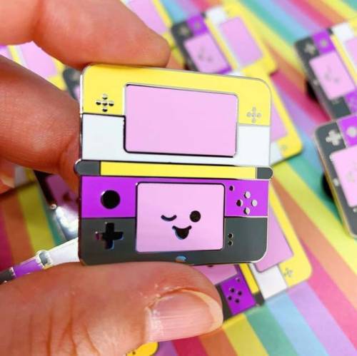 wind-up-key:retrogamingblog:LGBT+ Flag Nintendo System Pins made by Jessica Kellogg-KuhnI love 