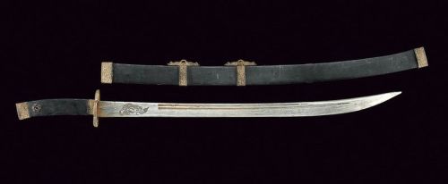 art-of-swords:  Dao Sword Dated: early 20th Century Culture: Chinese Measurements: length 90.5 cm The sword has a slightly curved, single-edged, damask blade, with a double groove, engraved with the effigy of a dragon on a face and ideograms on the other.