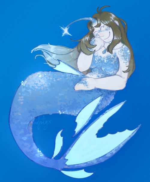 An illustration of a mermaid on a blue background. Her tail is curled beneath her, and she rests her head on her hand while smiling and looking to the top right. She has sparkly, blue scales covering her chest, shoulders, hands, cheeks, and tail. She has an anglerfish-like lure on her forehead. Her hair is brown, but fades to pale blue at the ends. She's also wearing a blue necklace.