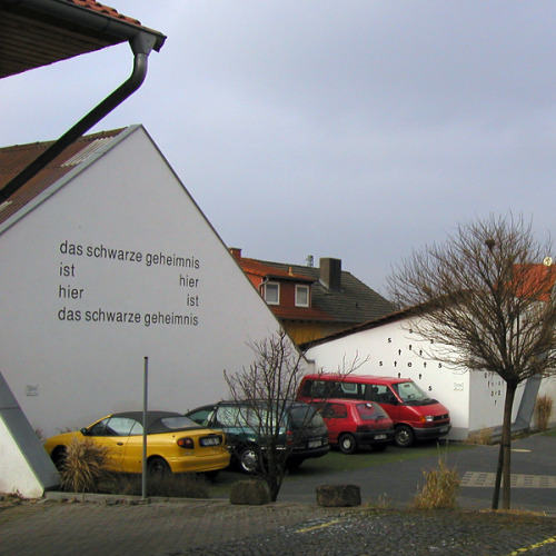 visual-poetry:  hünfeld is a town in germany with more than 100 concrete poems on house fronts. “das offene buch in hünfeld” 