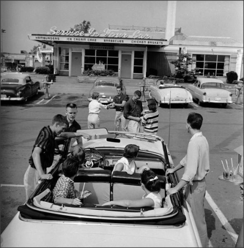 Teens, 1950sTeenagers hanging out at the local drive in