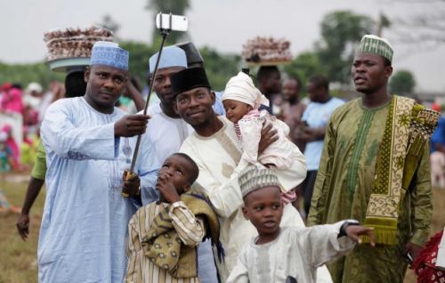 letswakeupworld: A Nigerian Muslim family takes a selfie before Eid-al-Fitr prayers in Lagos, Nigeri